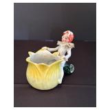 Figurine With Yellow Flower Pot