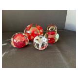 Four Glass Paperweights in Various Designs