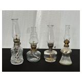 Four Clear Glass Oil Lamps