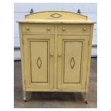 Yellow Wood Cabinet With Drawers and Doors