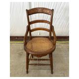 Wooden Chair With Cane Seat and Carved Backrest