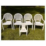 Five White Plastic Chairs