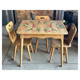 Wooden Table With Three Painted Chairs