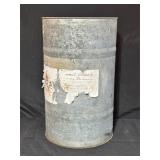 Metal Drum with Torn Paper Labels
