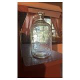 Half gallon White House vinegar, jug, with finger
