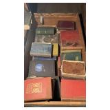 Flat storage trunk with vintage books, mostly