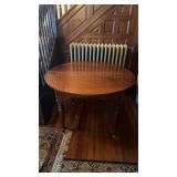 Antique round table, with decorative corners,