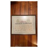Vintage framed cross stitch sampler  with a house