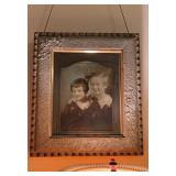 Antique frame with an old photograph, hanging in