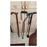 Three walking canes, including a very well-made,