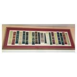 Framed collection of leather bookmarks