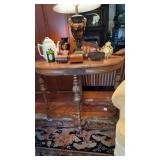 Oval side table, carved legs, contents on top not