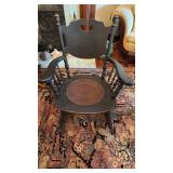Antique rocking chair with an old press leather