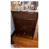 Four drawer, tall dresser, with some veneer