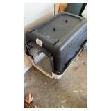 Medium size, dog kennel, black, and white out in