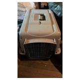 Small to medium size dog crate, with a carry