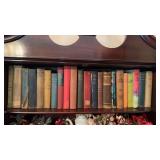 22 books and the top shelf of the secretary in