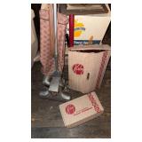 Vintage Kirby vacuum cleaner, with a box of