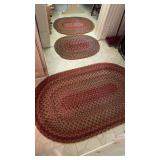3 matching oval, braided rugs, mostly in burgundy