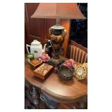 Tabletop items that includes a tea, leaf teapot,