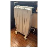 Delong brand coil space heater, on caster wheels,