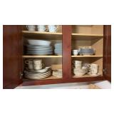 2 partial China sets in the kitchen cabinet, one