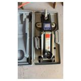 4000 pound hydraulic floor jack, and a carrying