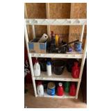 Plastic shelf unit with the contents, some flower
