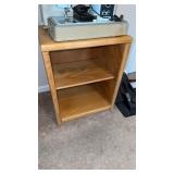 Small lightwood storage cabinet with one