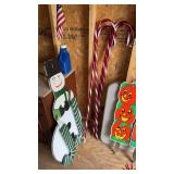 Four plastic candy canes 4 feet tall, with a 3