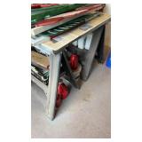 Two sawhorses, with a handmade table top, with