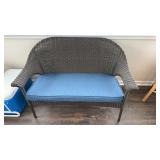 Woven plastic wicker settee, room for two, with