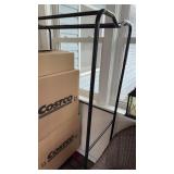 5 foot tall black metal clothing rack on