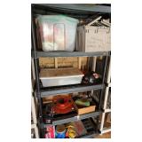 Black plastic shelf unit with the contents,