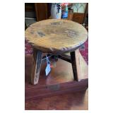 Small antique wooden milking stool, measures 10