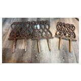 Three Cast Iron garden edge pieces with two legs