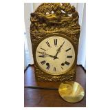 Antique clock face and works, and with a brass