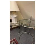 Three chrome and glass side tables, the larger