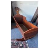 Large antique wooden baby cradle, with a swing