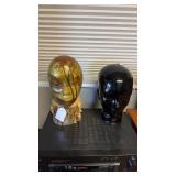 Two head sculptures, one carved wood and hand