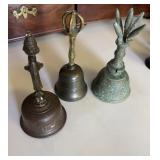 Three antique table bells, one bronze bell, with
