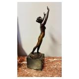 Antique nude woman, bronze figure, on a black