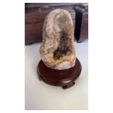 Polished pink amethyst geode crystal stone in