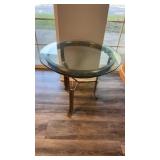 Modern three iron leg round side table with a