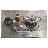 Porcelain collection, that includes a teapot,