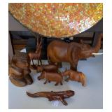 Carved African wood animals, with one kneeling
