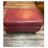 Vintage burgundy vinyl footstool measures 13