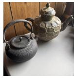 2 vintage teapots,  one is a carved green stone