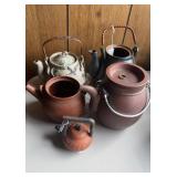 Collection of five ceramic teapots , two are