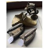 4 antique items, two 7  pound sad irons, one brass
